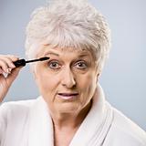 Older Woman Putting on Makeup