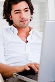 Attractive young man browsing the internet 