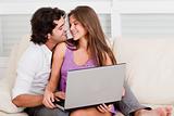 romantic young couple with laptop