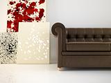 Leather couch and abstract canvas
