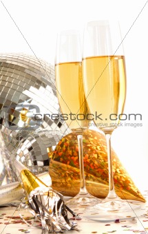 Champagne glass with gold party hats