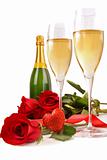 Champagne glasses with red roses and little heart
