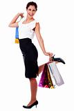 young woman holding a shopping bag with