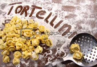 Fresh, raw tortellini with flour