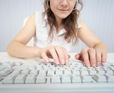 Woman working at computer keyboard