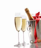 Glasses of champagne with red ribbon gift