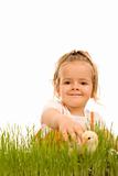 Little girl catching the small Easter chicken
