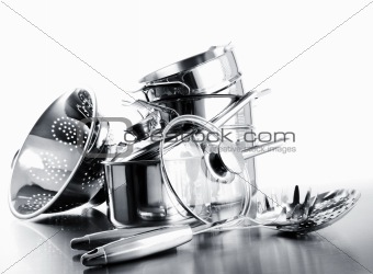 Pile of pots and pans against  white