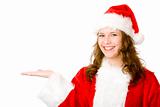 Happy Santa Claus woman holding hand for advertisement sign
