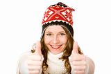 Young happy smiling woman with cap and scarf shows both thumbs u