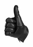 a black glove making the gesture of thumbs up