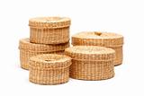 Stack of Various Sized Wicker Baskets Isolated on White.