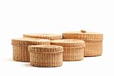 Various Sized Wicker Baskets Isolated on White - Focus is on the Front Small Basket.