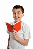Smiling school student holding small book