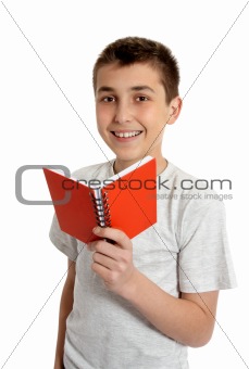 Smiling school student holding small book