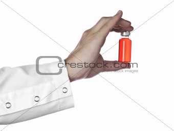 Red vial on a hand