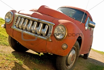 Red rusty vintae car