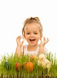 Little girl with easter eggs and baby chickens