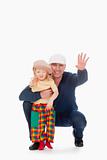 father and son with caps smiling and waving - isolated on white