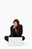 attractive young businesswoman working with laptop computer smiling