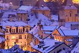 prague - winter view of lesser town rooftops covered with snow 