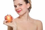beautiful young blonde woman holding a red apple