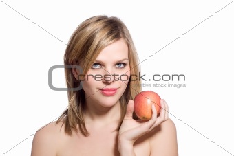 beautiful young blonde woman holding a red apple