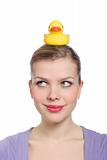 woman with a yellow rubber duck on her head