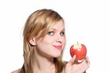 blonde woman holding a red apple which has been bitten into