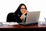 business woman working at her desk with a laptop