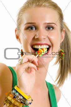 blond woman licking candy