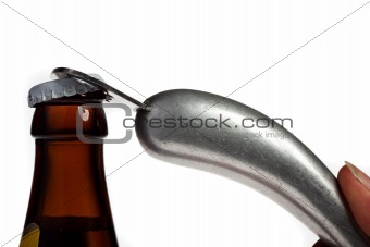 Hands opening a beer bottle on a white background