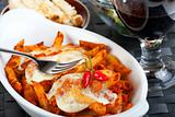 rigatoni pasta with tomato sauce and melted cheese