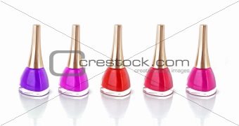  Group of nail polishes of different colors on white background