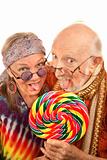 Hippie seniors licking a lollipop