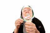Funny nun with blowing bubbles