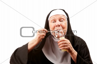 Funny nun with blowing bubbles