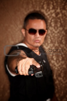 Hispanic Cop Pointing Gun