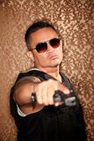 Hispanic Cop Pointing Gun