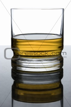 whisky on black granite with overexposed background