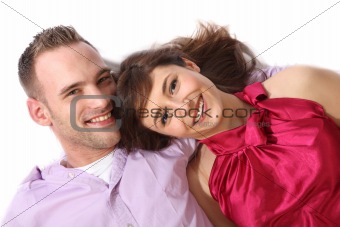 Young, happy couple lying on the floor