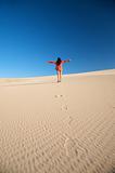happy woman on desert dune