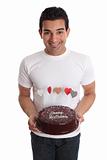 Man carrying chocolate cake decorated with hearts
