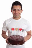 Man carrying romantic heart cake