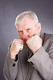 Elderly man in a pose of boxer