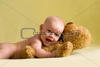Happy baby with Teddy bear