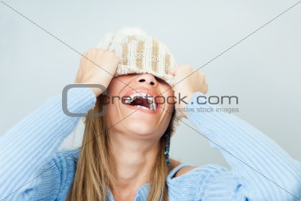 woman covering face with hat
