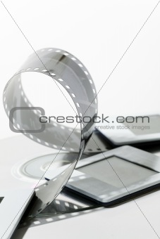 negative film strip, cd and dia on white background