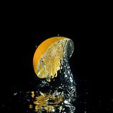 orange splashing out of water