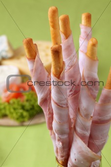 Bacon wrapped grissini and cheese